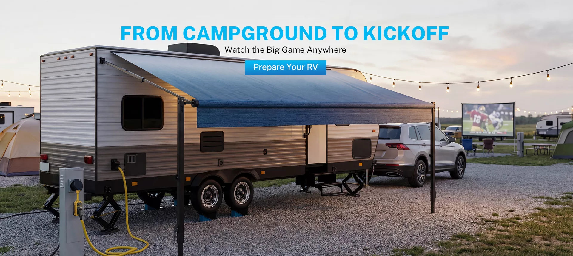 RV with extended awning in a campground setting