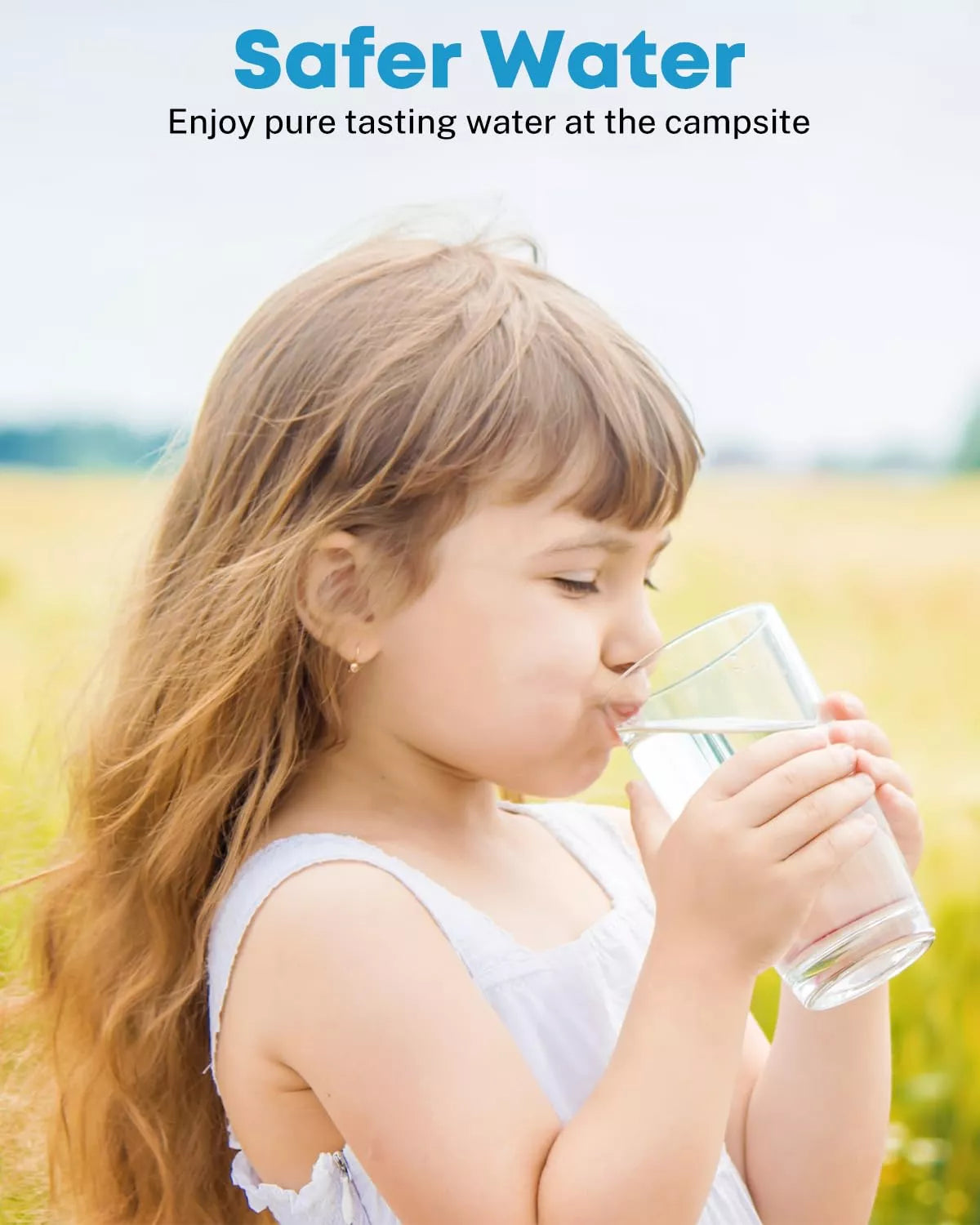 Child drinking water from a glass at the campsite
